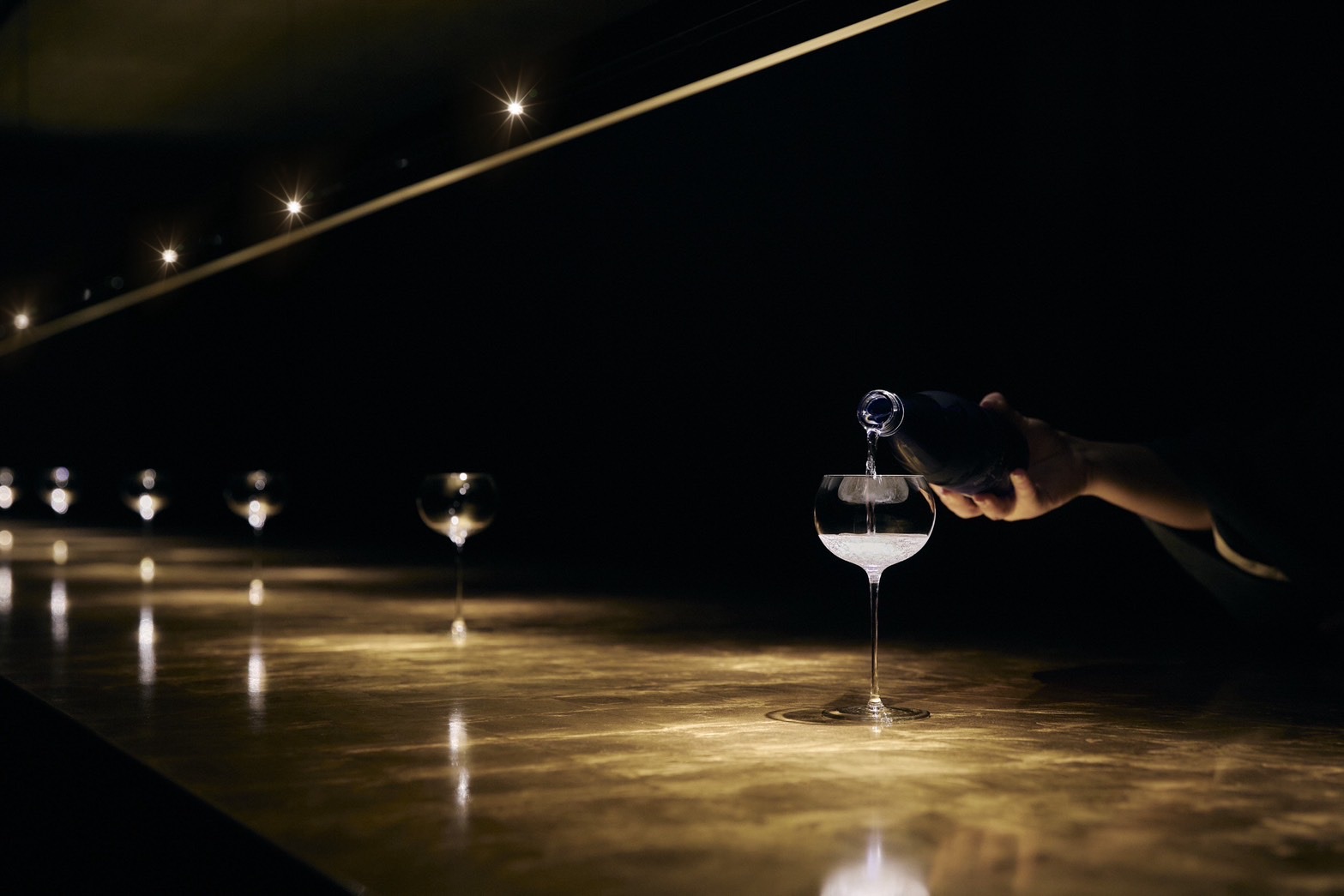 Sake poured at the members-only bar